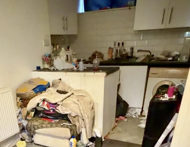 Before: a flat left full of rubbish, with a damaged kitchen