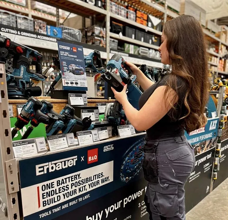 Emma testing power tools in a B&Q TradePoint store